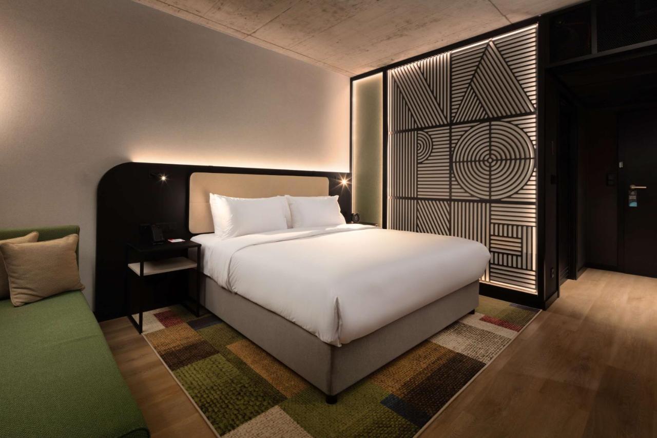 Habitación Deluxe con cama extragrande y sofá cama